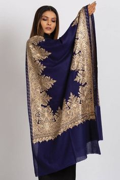 Our Priya Embroidered Shawl features fine embroidery on soft 100% merino wool. Specialty piece.This classically beautiful shawl showcases the intricate embroidery traditions of Northern India with stunning embroidery in metallic tones on a black base. Suitable for a black tie event, evening out, dinner party. Can change the look of last year's dress or pantsuit. A formal living room, drape over the back of the couch. The high quality and elegance of our embroidered shawls make them treasures tha Elegant Pashmina Shawl With Intricate Embroidery For Festive Occasions, Elegant Embroidered Pashmina Shawl For Festivals, Elegant Jamawar Pashmina Shawl For Winter, Elegant Winter Dupatta With Zari Work, Elegant Winter Dupatta With Resham Embroidery, Elegant Resham Embroidery Winter Dupatta, Elegant Pashmina Shawl With Intricate Embroidery For Festivals, Elegant Embroidered Traditional Shawl, Elegant Pashmina Dupatta With Zari Work