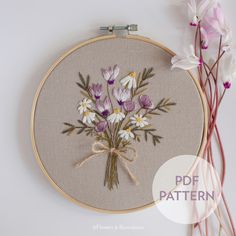 an embroidery project with flowers on it and the words'free pattern'in front of it