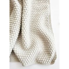 the blanket is made up of white yarn