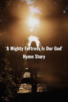 a person standing on a path with the sun shining behind them and text that reads, a mighty fortress is our god