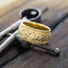 Introducing our exquisite solid gold ring, a masterpiece that brings ancient Roman history to life. This unique piece features a stunning 3D depiction of Emperor Caracalla, inspired by the late 1st-century AD marble relief housed in the Palazzo della Cancelleria. On one end, you'll find the iconic Capitoline Wolf nurturing Romulus and Remus, while the other end showcases a majestic Roman eagle. Both are adorned with laurel wreaths and the revered SPQR acronym, symbolizing "the Senate and People of Rome." This ring is not just a piece of jewelry but a timeless tribute to the grandeur of Roman civilization. This ring also comes with a high quality gift box with a message engraved on the top. You can write what you would like engraved in the notes section when checking out or personalization Byzantine Engraved Yellow Gold Rings, Yellow Gold Symbolic Carved Jewelry, Byzantine Yellow Gold Engraved Rings, Byzantine Style Engraved Yellow Gold Ring, Symbolic Gold Intaglio Jewelry, Carved Symbolic Yellow Gold Jewelry, Traditional Carved Yellow Gold Rings, Gold Byzantine Carved Jewelry, Gold Ceremonial Rings With Carved Details