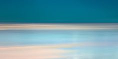 an abstract photograph of the ocean and sky