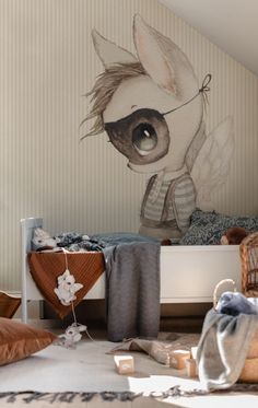 a child's bedroom with a large wall mural