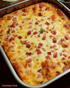 a casserole with ham and cheese in a pan next to other food items