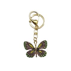 a key chain with a butterfly charm hanging from it's center, on a white background