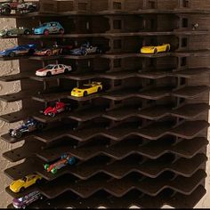 there are many toy cars on the shelves