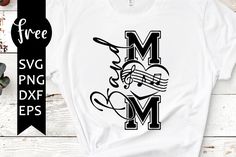 a white t - shirt with the letter m and music notes in black on it