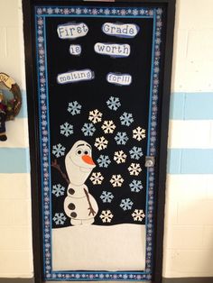 a door decorated to look like a snowman with the words first grade is worth written on it