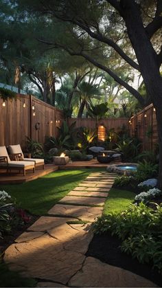 a backyard with grass and lights on the trees