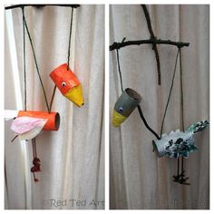 three different types of birds hanging from the side of a curtain with strings attached to them