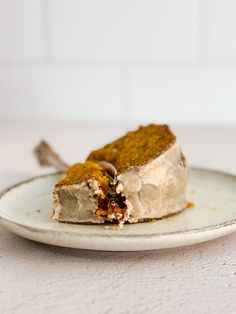 a piece of cake sitting on top of a white plate