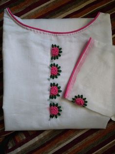 two white shirts with pink roses on them