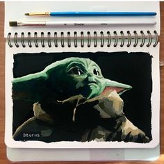 a drawing of the child yoda from star wars is shown on a notepad