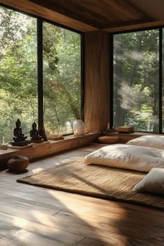 a bed sitting in a bedroom next to large windows