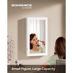 a woman is brushing her teeth in front of a mirror with the words, small figure, large capacity