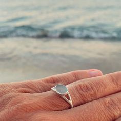 * The story  - Collecting beach treasures is my favourite! You wear something unique that I found in a beach of a Greek island! * Details - It's made of silver 925 and an aqua seaglass - Sea glass dimentions ~ 0,8×0,7 cm - ring size 6 1/4 US (1,65 cm diameter) - This listing is for one piece only. - I don't use wax technics so every piece has a little difference from the other. In the way that I finish them you will see that they are made from a human hand.  * Shipping Ready to ship in 1-2 business days via Hellenic post with tracking number.  * Packaging With the packaging you will receive a summer feeling because every piece is made for summer lovers. Ready to be gifted. Minimalist Silver Rings For The Beach, Ocean-inspired Silver Rings For The Beach, Minimalist Sea Glass Jewelry For Beach, Silver Sea Glass Ring For Beach, Human Hand, Summer Feeling, Greek Island, Multi Stone Ring, Greek Islands