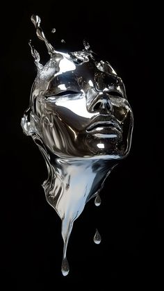 a metal sculpture with water splashing on it's face and the bottom part of its head