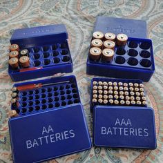 three batteries are sitting on top of each other in blue boxes with the words aa batteries written on them