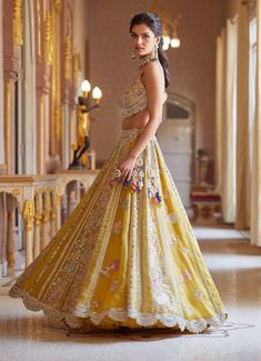 Editor's Note Hand Embroidered Panelled Lehenga Set With Zardosi Details And French Knots Fabric: Organza Color: Honey Gold Care: Dry Clean Only About the Designer A melange of rich embroideries, appliques, impeccable weaving, brilliant printing, and dyeing, Osaa by Adarsh is a story of India’s rich textile traditions replicated to form wedding couture. Adarsh Makharia saw the endless opportunities to engage the diverse artisans and designs and, with Osaa, weaved together a celebration of India’ Gold Organza, Organza Lehenga, Red Lehenga, Embroidered Organza, French Knots, Designer Lehenga Choli, Bridal Lehenga, Lehenga Choli, Embroidered Blouse