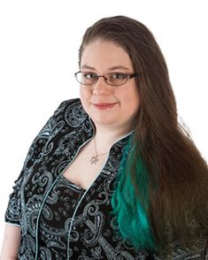 a woman with long green hair and glasses