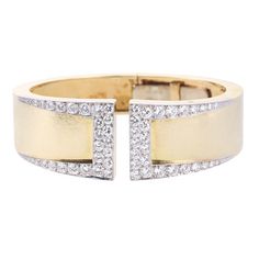 18k yellow gold and platinum Gap cuff bracelet by David Webb. Retail $42000. Set with approx. 3.40ctw SI1/H diamonds. DESIGNER: David Webb MATERIAL: 18k Gold / Platinum GEMSTONES: Diamond DIMENSIONS: Bracelet will fit an approx. 6.5" wrist, width 23mm. MARKED/TESTED: Webb, Plat, 18k. WEIGHT: 65.6 grams CONDITION: Previously Owned/Excellent Condition Designer Diamond Cuff Bracelet Bangle, Designer Diamond Cuff Bangle Bracelet, Formal Cuff Bracelet With Brilliant Cut Diamond, Formal Diamond Cuff Bracelet With Brilliant Cut, Modern Cuff Bracelet With Diamond Accents For Formal Events, Polished Yellow Gold Diamond Cuff Bracelet, Formal Yellow Gold Diamond Cuff Bracelet, Modern Yellow Gold Cuff Bracelet With Single Cut Diamonds, Modern Gold Diamond Cuff Bracelet