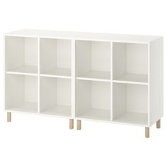 a white bookcase with wooden legs and four sections on each side, in front of a white background