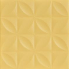 an image of a yellow wall tile with wavy lines on the top and bottom half