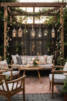 an outdoor seating area is decorated with flowers and greenery, hanging from the pergolated trellis