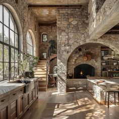 a kitchen with stone walls and an arched doorway leading up to the second floor is shown