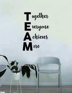 there is a wall sticker that says together everyone achieves one in black and white