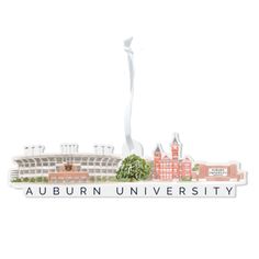 the auburn university campus sign is shown in front of a white building with a tall spire