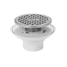 a white drain strainer with an open hole on the side and a metal grate in