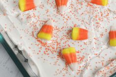 there are candy corn on top of the cake