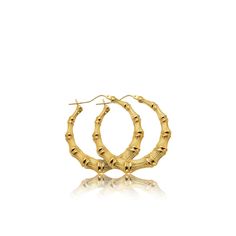 "LoveBling 10k Yellow Gold Bamboo Hoop Earrings (1.40\") Crafted in 10k Yellow Gold 1.40 inch Diameter Snap post earring closure There is nothing more stylish than a pair of 10-karat Yellow Gold Bamboo Hoop Earrings. They're a versatile look that can be paired with any kind of outfit and are suitable for any occasion. The snap post earring closures support a full hoop shape that is crafted in resilient, eye-catching 10k Yellow Gold. Its gold composition is tougher than most gold types, allowing Bamboo Hoop Earrings, Clean Gold Jewelry, Figaro Chain Necklace, Gifts For My Girlfriend, Bamboo Design, 10k Gold, Rose Gold Ring, Post Earrings, Gold Chains