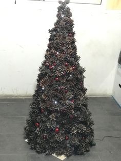 a christmas tree made out of pine cones