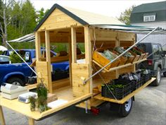 a truck with a wooden structure on the back