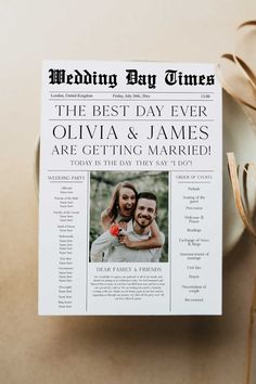 the wedding day newspaper is sitting on top of a table