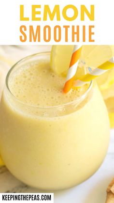 a lemon smoothie in a glass with a striped straw