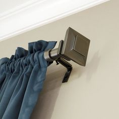 the curtain is pulled back by an adjustable rod and has a metal hook on it