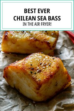 two pieces of grilled sea bass sitting on top of wax paper with the words best ever chilean sea bass in the air fryer