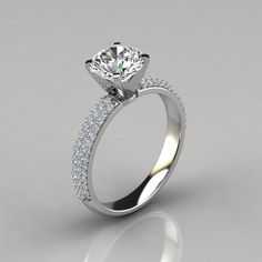 a white gold engagement ring with diamonds on the side