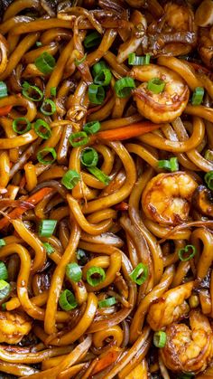 an overhead view of noodles with shrimp and scallops