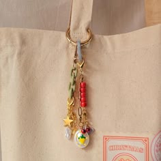 a close up of a bag with charms on it