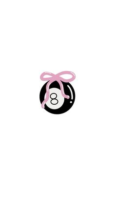 a black and white pool ball with a pink bow