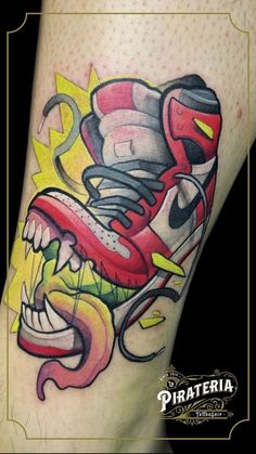 an artistic tattoo design on the leg of a person with roller skates and flames