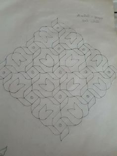 a drawing of an intricate design on paper