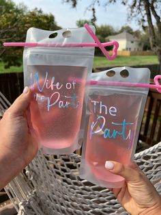 two pink drinks in plastic bags with the words mime of the party on them