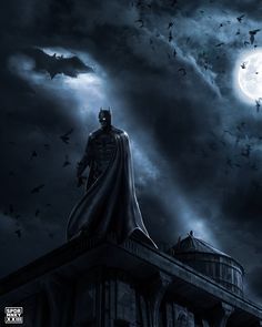 the dark knight is standing on top of a building in front of a full moon