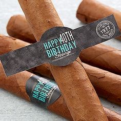 several cigars are arranged on the floor with a sign that says, happy birthday