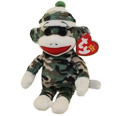 a stuffed monkey with a tag on it's ear and camouflage print outfit,